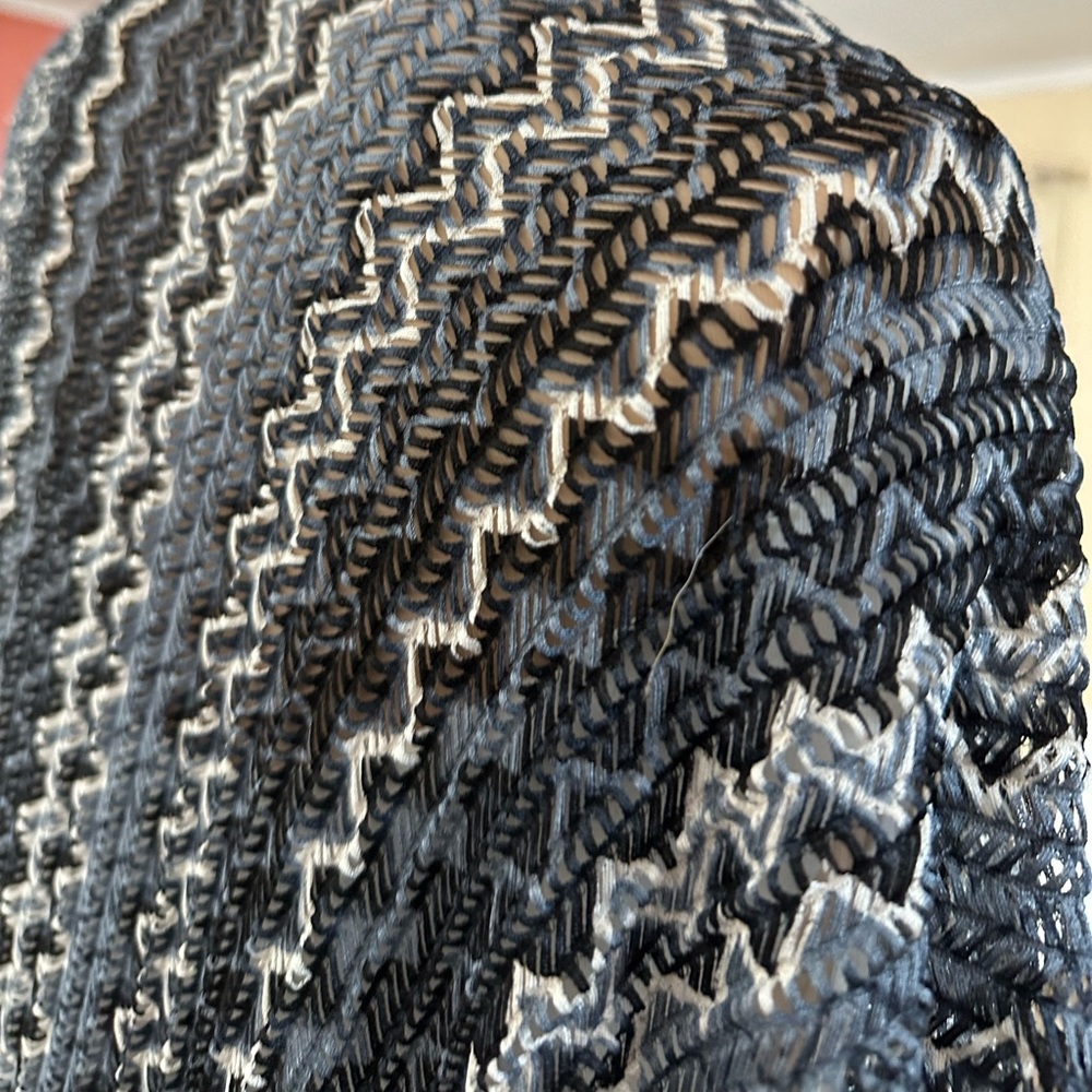 A wrap that can be worn with a dress or slacks.